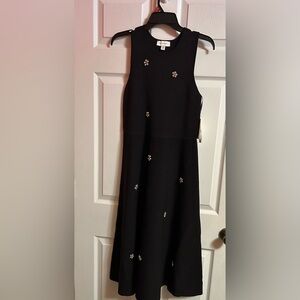 Free Assembly Elegant Black Sleeveless Dress with Floral Accents